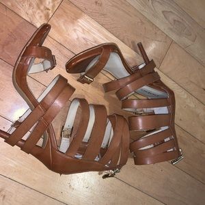 high heels with many straps wrapped around